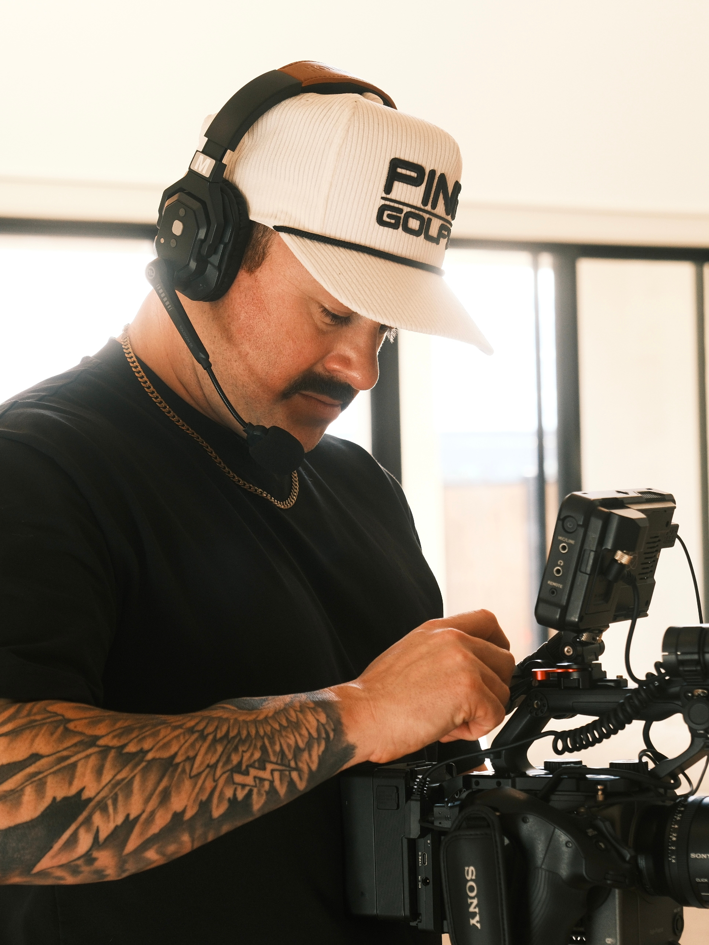 Matt Giesow operating a Sony cinema camera on set