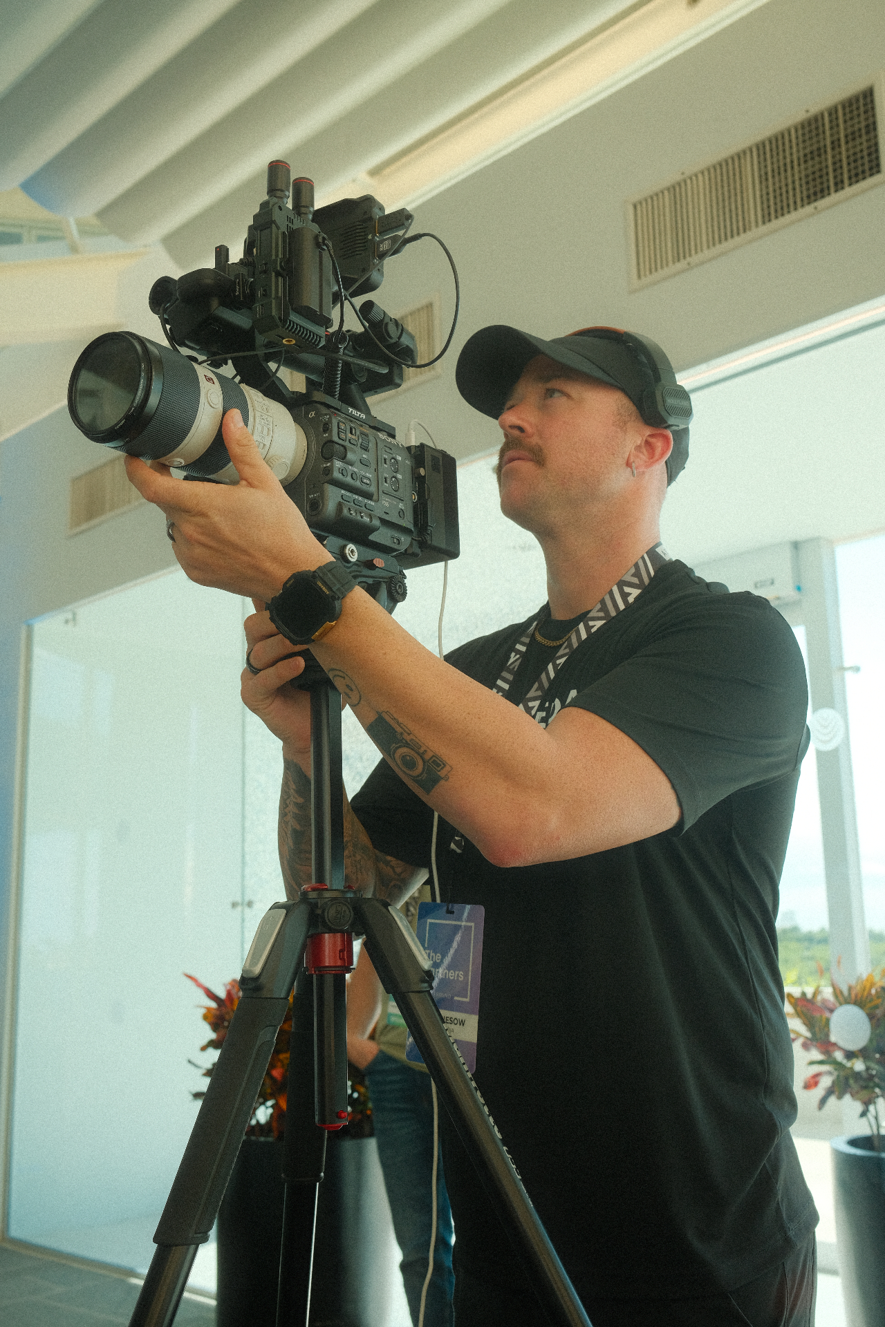 Matt Giesow filming with a Sony FX camera on a tripod